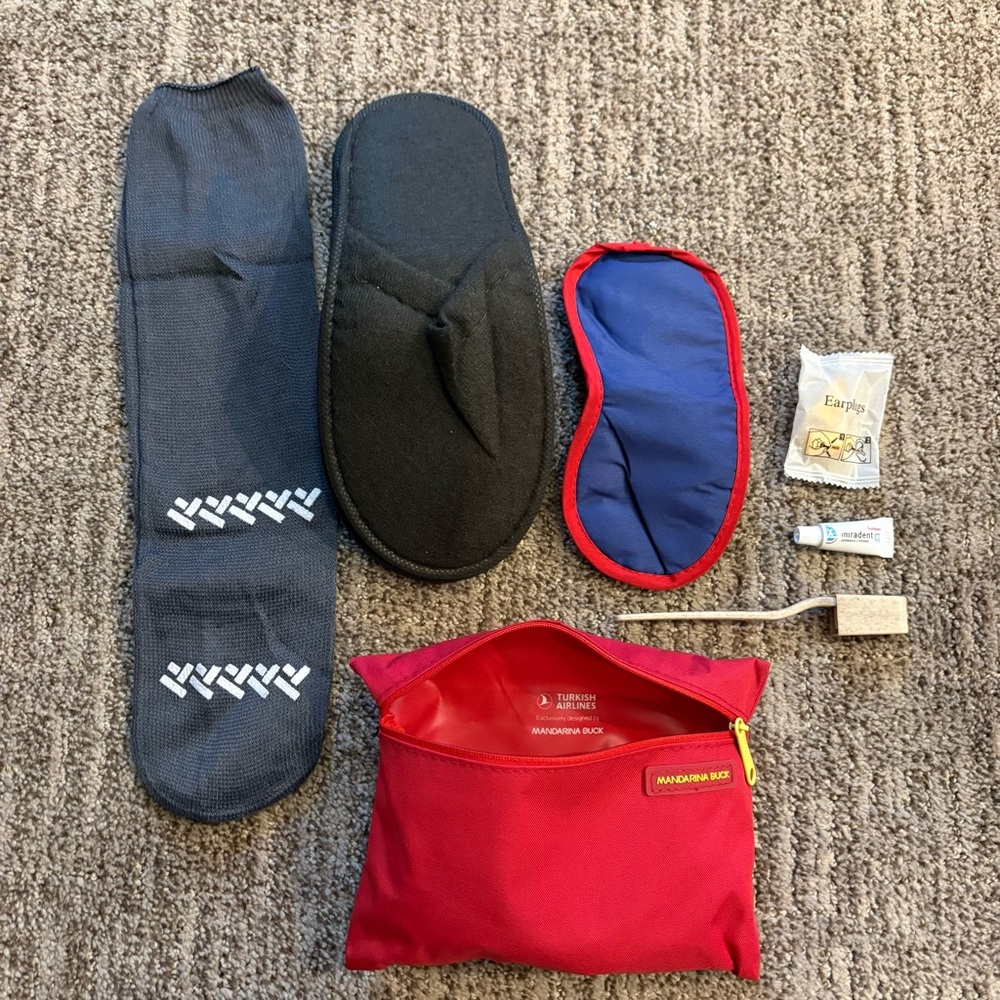 Mandarina Duck amenity kit travel bag from Turkish Airlines with contents, red